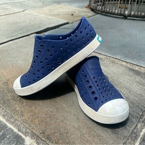 Navy blue Natives, some wear/scuffs on the toes, size C11